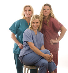 Image showing three nurses in medical scrubs clothes