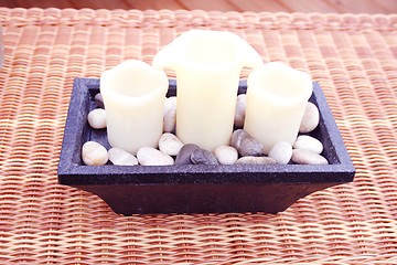 Image showing Candles on wicker table