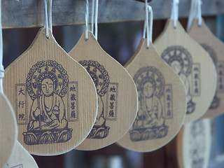 Image showing Wooden badges of Buddha