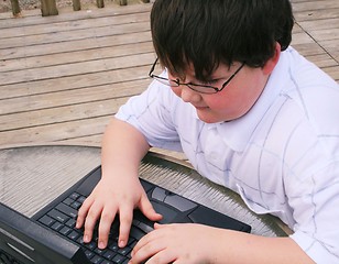 Image showing Young man working on laptop