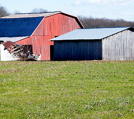 Image showing Two old barns