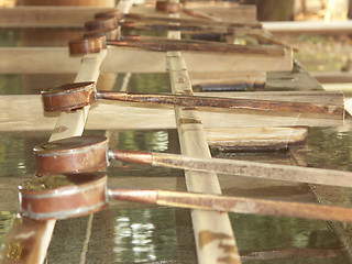 Image showing Water buckets in a Japanese shrine