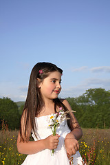 Image showing Young Girl with Flowers