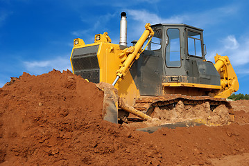 Image showing Close view of heavy bulldozer moving sand in sandpit