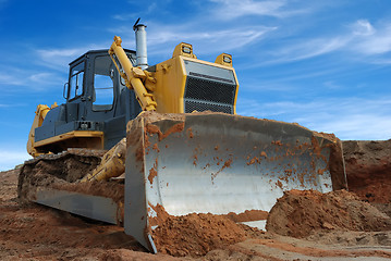 Image showing Close-up view of heavy bulldozer standing in sandpit