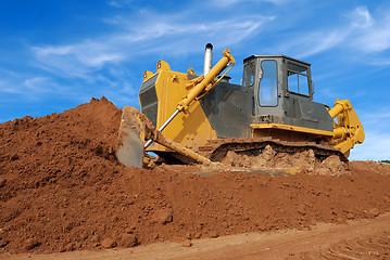 Image showing heavy bulldozer moving sand in sandpit