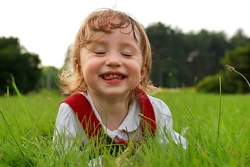 Image showing Little girl expressing fun with closed eyes