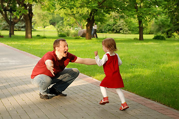 Image showing man playing with little girl