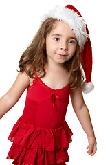 Image showing Child wearing a red Santa hat