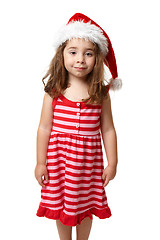 Image showing Girl wearing a santa hat at Christmas time