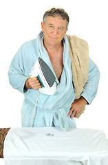 Image showing Grumpy Man Ironing