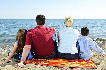 Image showing Family sitting at beach