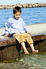 Image showing Boy playing on pier