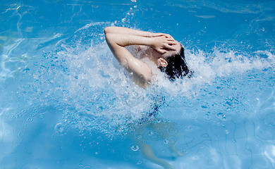 Image showing Women moving in a pool