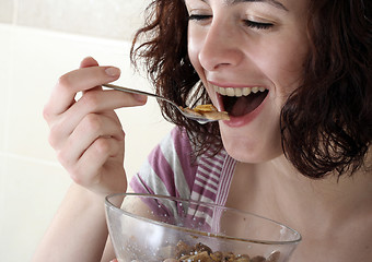 Image showing Young people eating milk with cereals