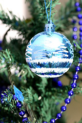 Image showing Christmas ornaments on tree.