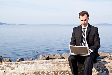 Image showing Caucasian businessman with laptop