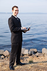 Image showing Caucasian businessman with laptop