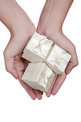 Image showing Hand and and White Gifts