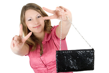 Image showing Beautiful playful young woman with a handbag. Isolated 