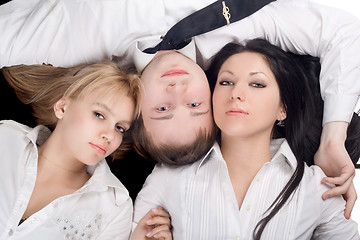 Image showing Portrait if the young man and two beautiful girls