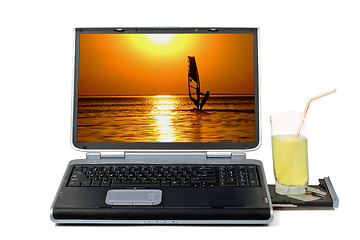 Image showing Laptop and cocktail. Isolated on white background