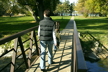 Image showing Mother and Son walking on the Park Bridge