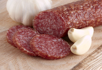 Image showing Sliced sausage with garlics