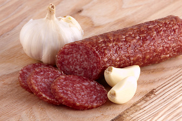 Image showing Sliced sausage with garlics