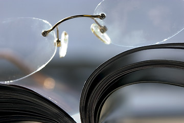 Image showing Close up on a pair of Glasses and the Magazine