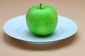 Image showing Green apple on white plate