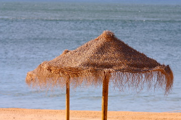 Image showing  View of straw sunshades