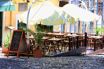 Image showing empty tables in street cafe