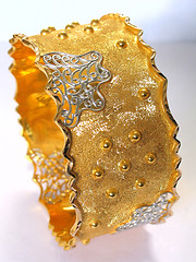 Image showing Closeup of a gold bangle