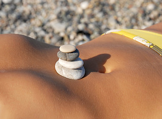 Image showing Rocks stack on stomach