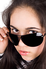 Image showing Portrait of the girl in sunglasses. Isolated