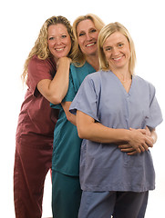 Image showing three nurses in medical scrubs clothes