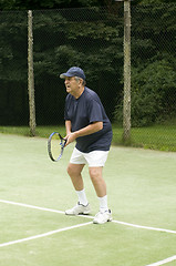 Image showing senior man playing tennis