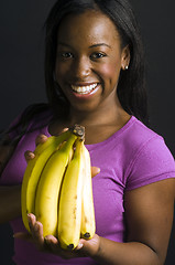 Image showing portrait smiling happy latin woman with bananas