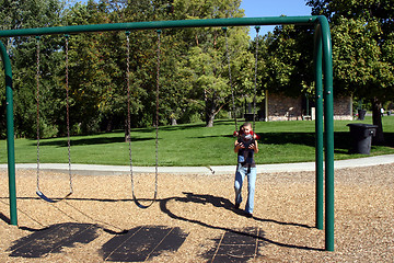 Image showing Little Boy Swinging