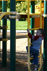 Image showing Kid Climbing Up the Slider