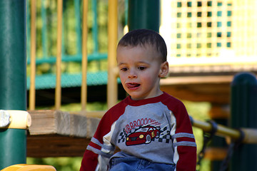 Image showing Little Boy Sitting on the Slider Top