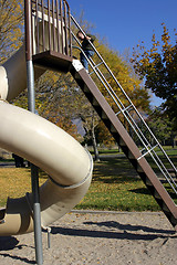 Image showing Kid Climbing Up the Slider with Hand in Focus