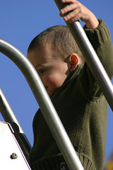 Image showing Kid Climbing Up the Slider