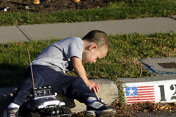 Image showing Little Boy Looking At the Ants
