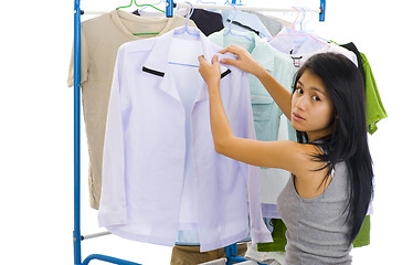 Image showing woman hanging clothes