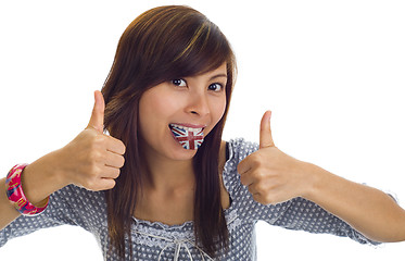 Image showing woman with british flag on tongue