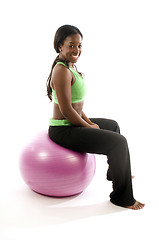 Image showing young pretty hispanic african american woman exercising with fit