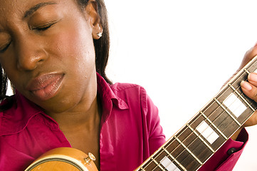 Image showing young hispanic black woman playing electric guitar