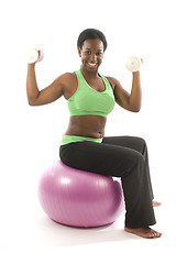 Image showing young pretty hispanic african american woman exercising with fit